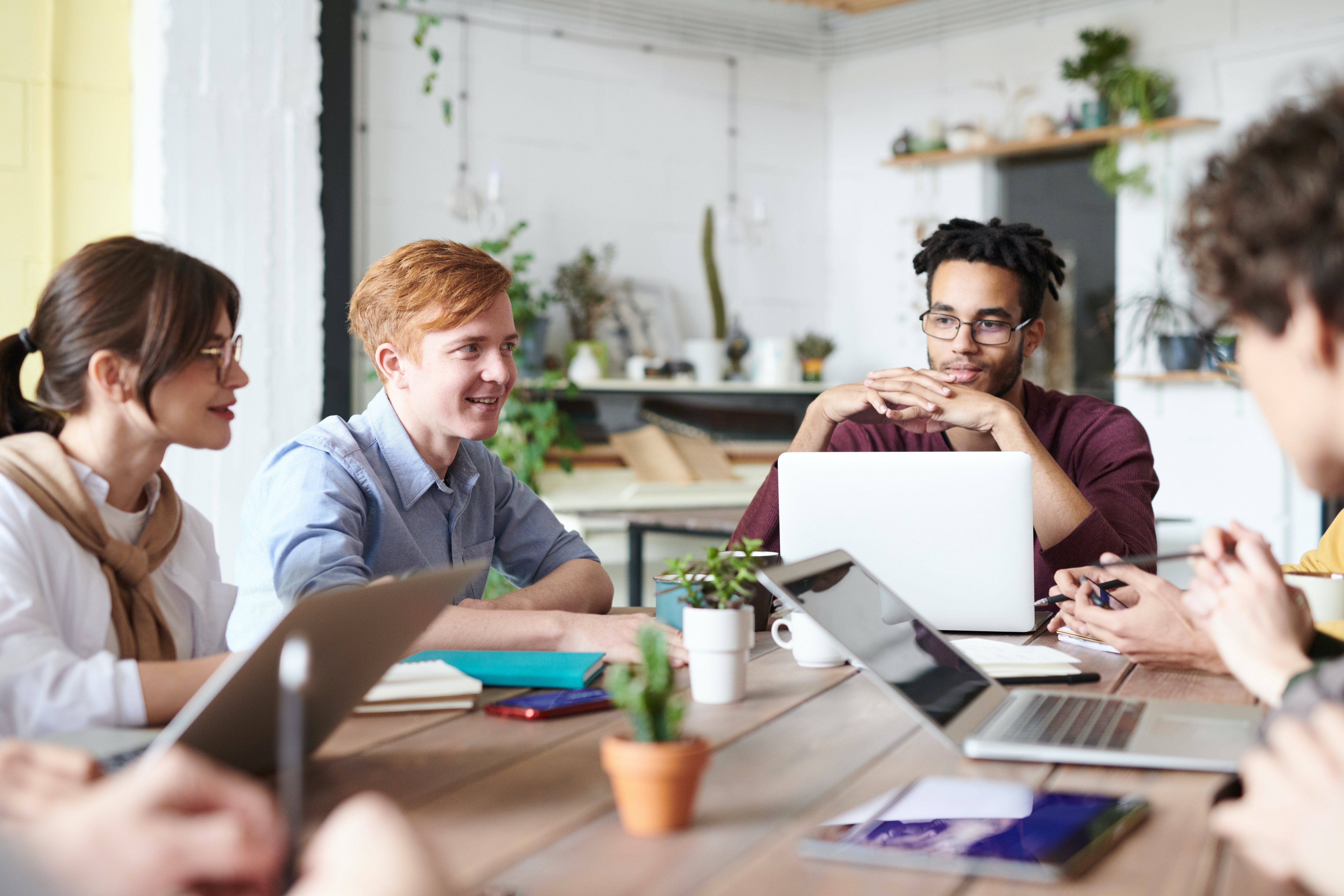 stock photo of a team collaborating thunkable organizations no code drag and drop app builder