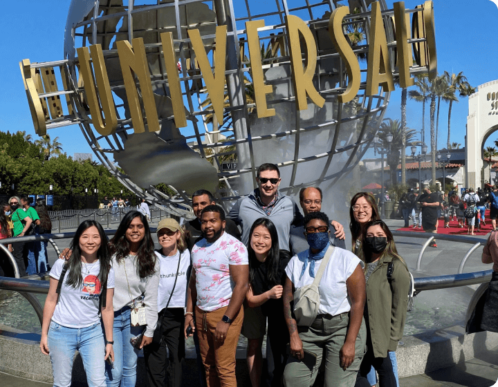 Thunkable team posing in front of the Universal Studios sign.
